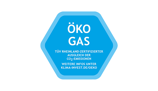 Blaues, sechseckiges Siegel mit der Beschriftung: " Öko Gas - TÜV-Rheinland-zertifizierter Ausgleich der CO2-Emissionen - weitere Infos unter klima-invest.de/oeko"